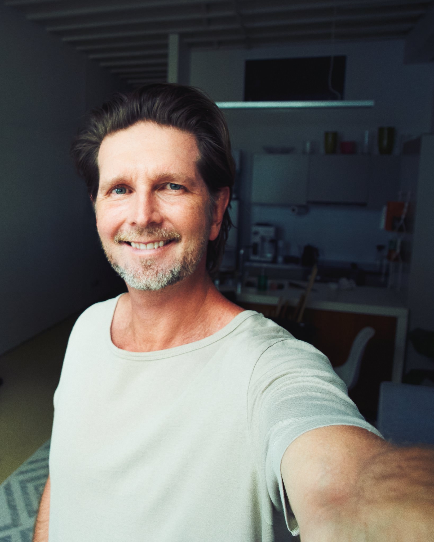 Portrait of Dave Blake in a studio space.